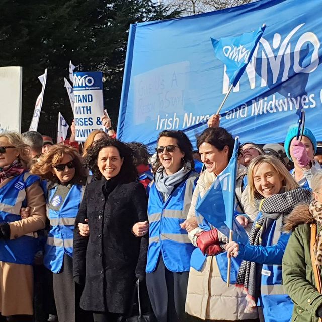 Tens of thousands march to support striking nurses and midwives